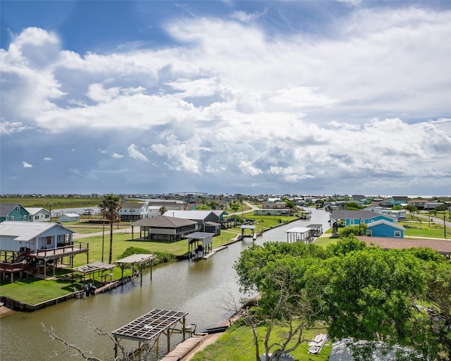 water view with a dock and a residential view