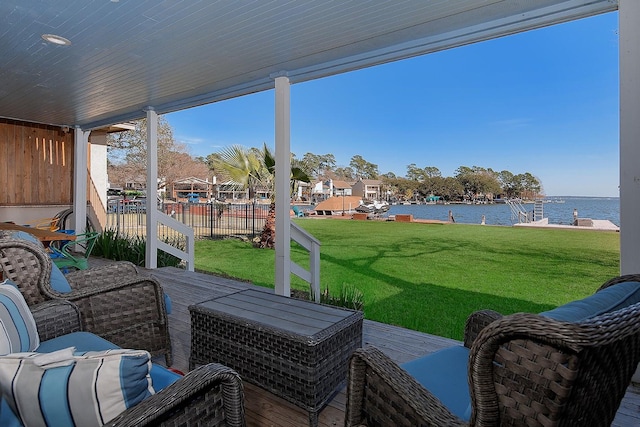 view of patio / terrace with a deck with water view