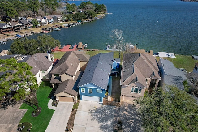 birds eye view of property featuring a residential view and a water view