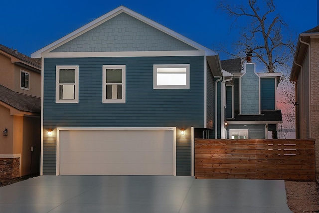 view of front of property featuring an attached garage and driveway