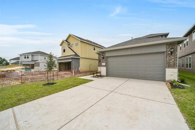 4215 Sternside Ln, Houston, TX 77053 - view of front facade with brick siding, driveway, a front yard, and roof with shingles