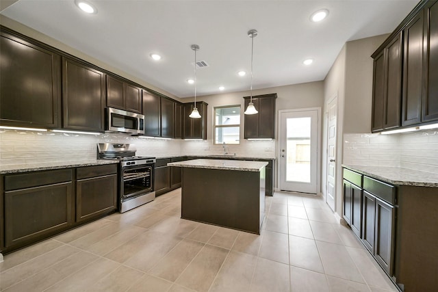 4215 Sternside Ln, Houston, TX 77053 - kitchen featuring appliances with stainless steel finishes, a sink, dark brown cabinetry, decorative backsplash, and light stone countertops