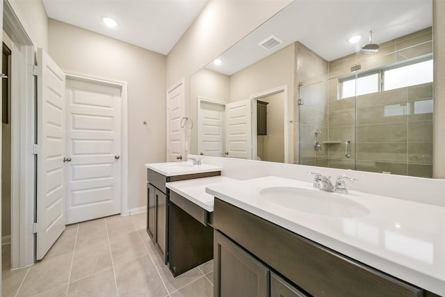 4215 Sternside Ln, Houston, TX 77053 - bathroom with double vanity, a shower stall, tile patterned floors, baseboards, and recessed lighting