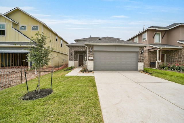 4215 Sternside Ln, Houston, TX 77053 - view of front facade featuring brick siding, an attached garage, a front yard, driveway, and roof with shingles