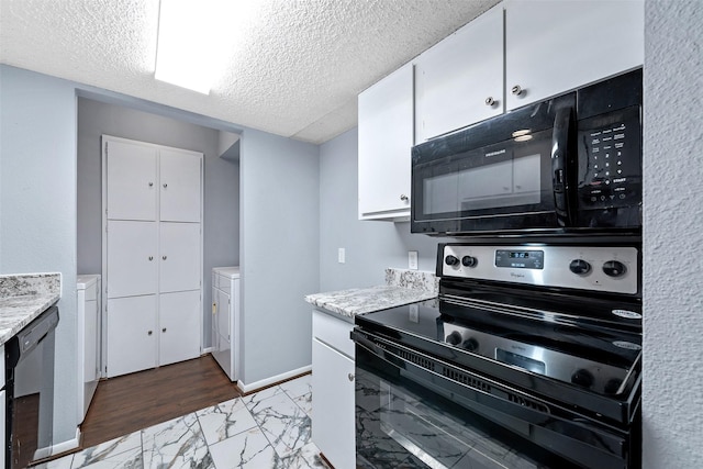 kitchen with marble finish floor, white cabinetry, black appliances, a textured ceiling, and baseboards
