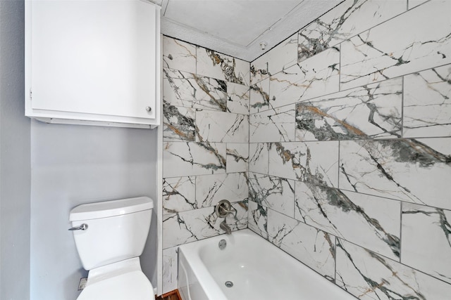 bathroom with bathtub / shower combination and toilet