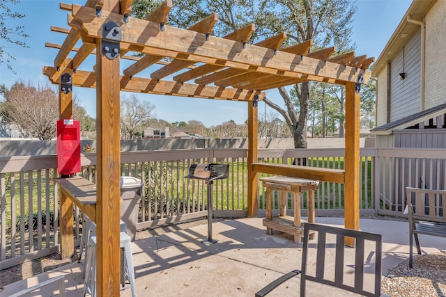 view of patio featuring fence and a pergola