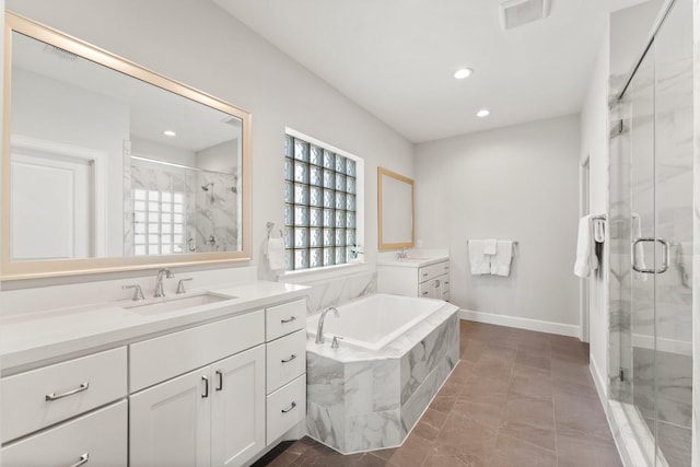 full bathroom featuring a stall shower, visible vents, and a sink