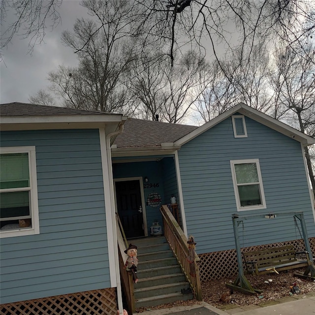 view of front of home featuring a shingled roof