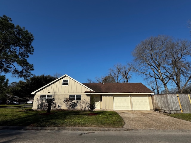 single story home with driveway, a garage, fence, board and batten siding, and a front yard