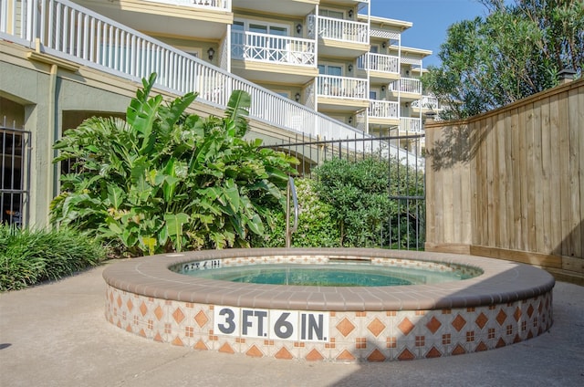 6300 Seawall Blvd Unit 9108, Galveston, TX 77551 - view of community featuring fence and a hot tub