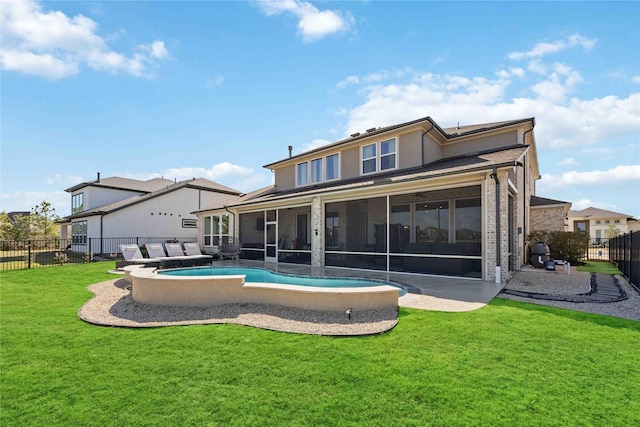 back of house with a fenced in pool, a lawn, a sunroom, a fenced backyard, and stucco siding