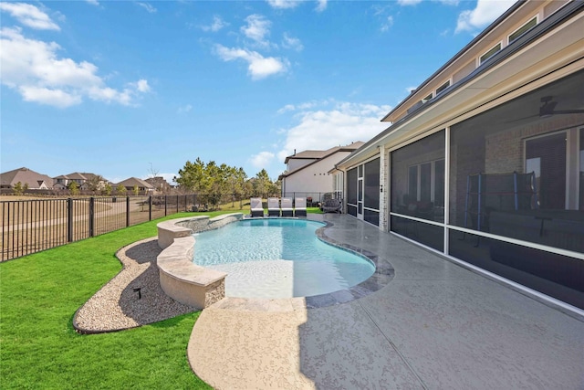 view of swimming pool featuring a fenced in pool, a yard, a patio, a sunroom, and a fenced backyard