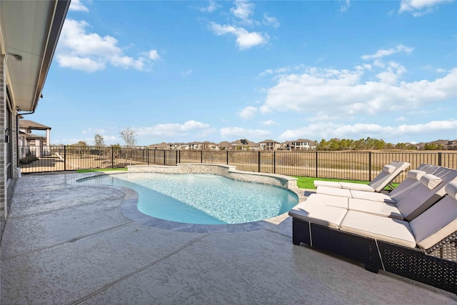 view of swimming pool with a patio area, a fenced backyard, and a fenced in pool