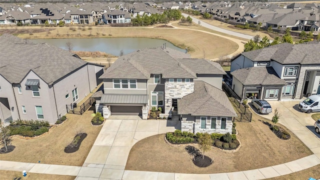 aerial view with a residential view and a water view