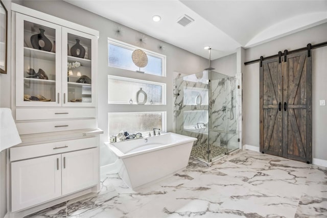 bathroom featuring a marble finish shower, baseboards, visible vents, marble finish floor, and a freestanding tub