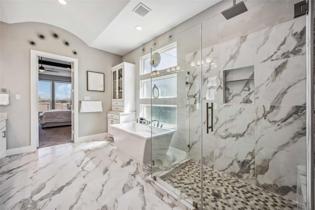 ensuite bathroom with a marble finish shower, baseboards, marble finish floor, a freestanding bath, and vanity