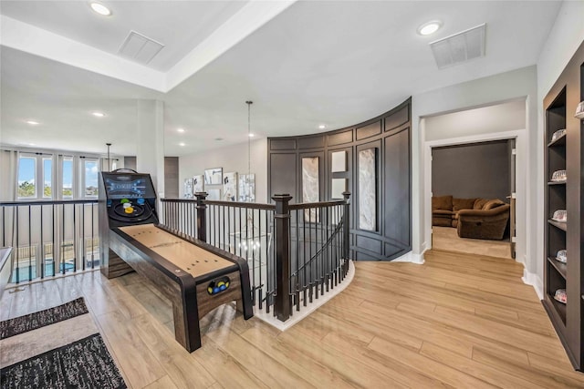 game room with light wood-style flooring, visible vents, and recessed lighting