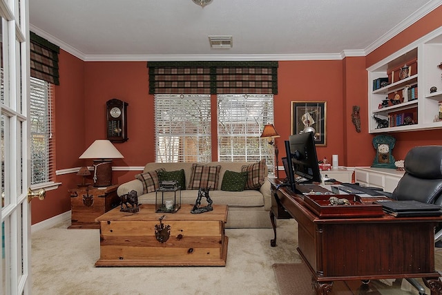 carpeted office space with ornamental molding and visible vents