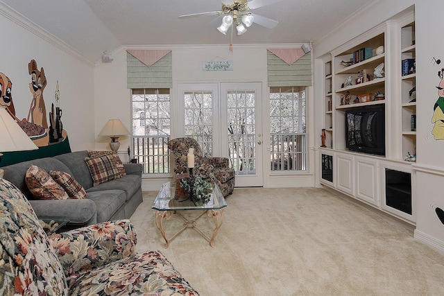 living room with ceiling fan, light carpet, built in features, vaulted ceiling, and ornamental molding