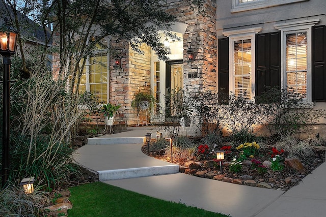 view of exterior entry featuring stone siding