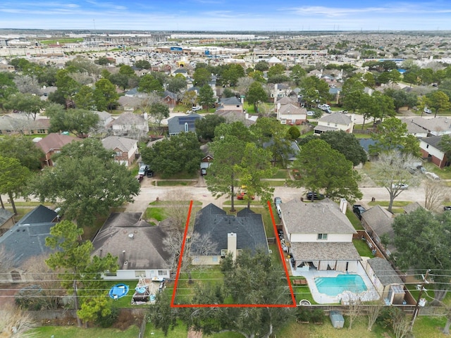 birds eye view of property with a residential view