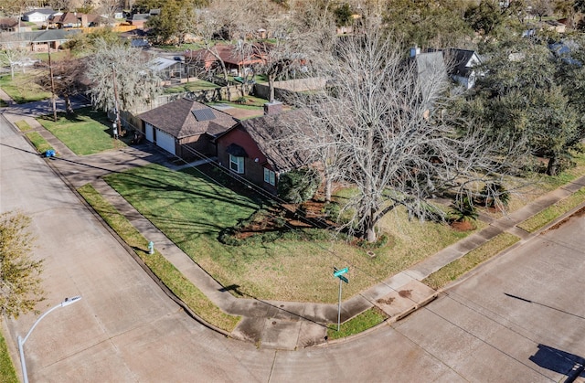 birds eye view of property with a residential view