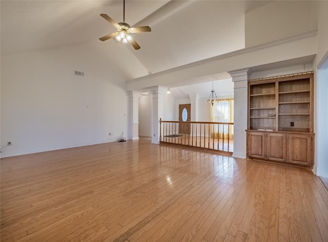 unfurnished living room featuring high vaulted ceiling, light wood-style flooring, ceiling fan with notable chandelier, visible vents, and decorative columns