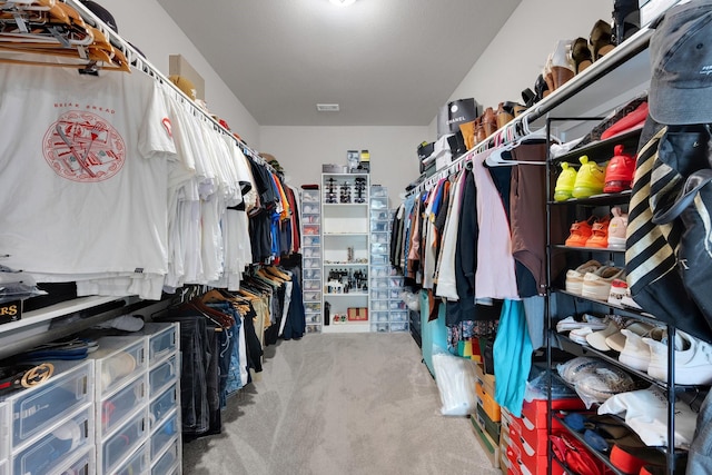 spacious closet with carpet flooring and visible vents