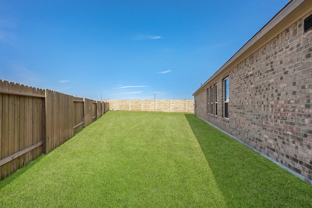 view of yard featuring a fenced backyard