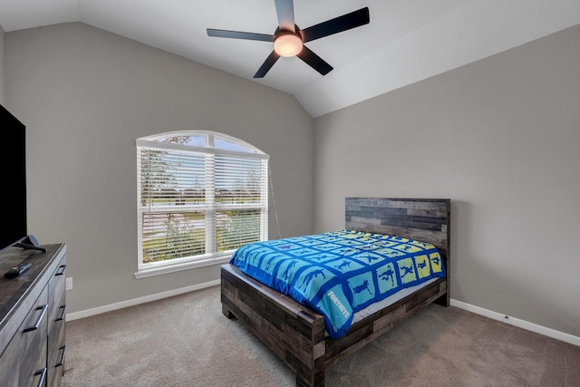 bedroom featuring lofted ceiling, carpet flooring, and baseboards