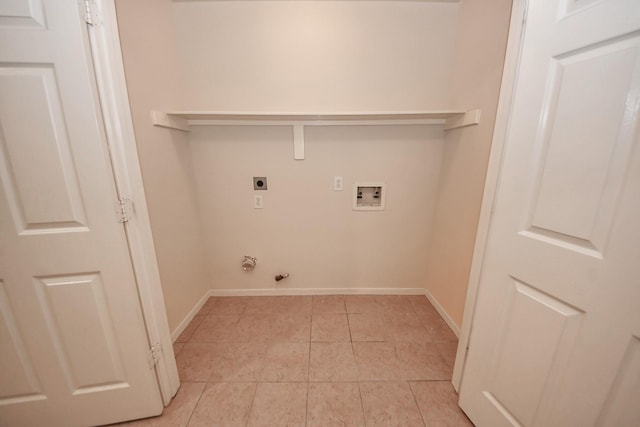 washroom with hookup for a gas dryer, laundry area, washer hookup, baseboards, and electric dryer hookup