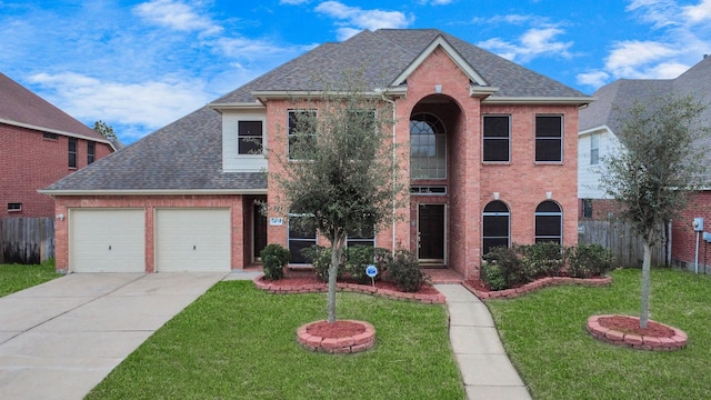 view of front facade featuring a shingled roof, fence, and a front lawn