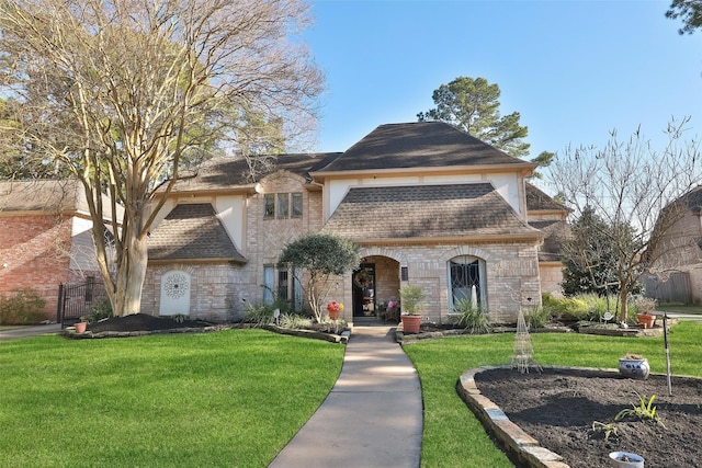 8011 Beaufort Dr, Spring, TX 77379 - view of front of property featuring a shingled roof, brick siding, and a front lawn