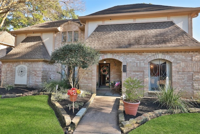8011 Beaufort Dr, Spring, TX 77379 - view of front of home with roof with shingles, brick siding, and stucco siding