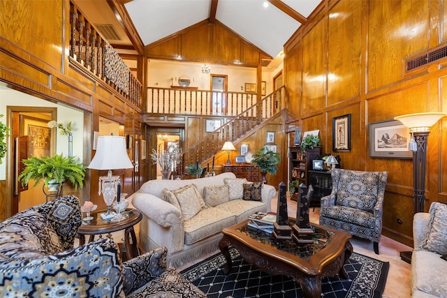 8011 Beaufort Dr, Spring, TX 77379 - living room with stairs, high vaulted ceiling, wood walls, and visible vents