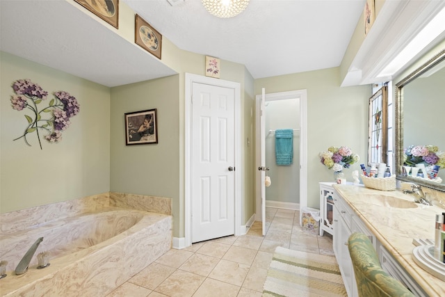 8011 Beaufort Dr, Spring, TX 77379 - bathroom featuring tile patterned flooring, baseboards, a bath, and vanity