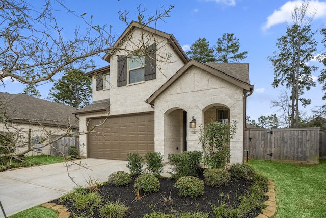 view of front of house featuring an attached garage, fence, concrete driveway, and roof with shingles