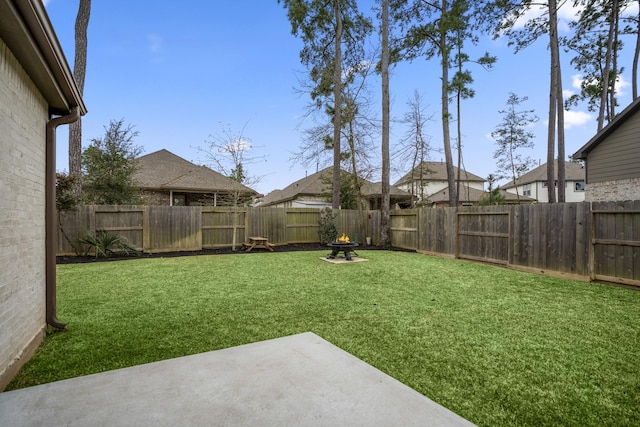 view of yard with a fenced backyard and a patio