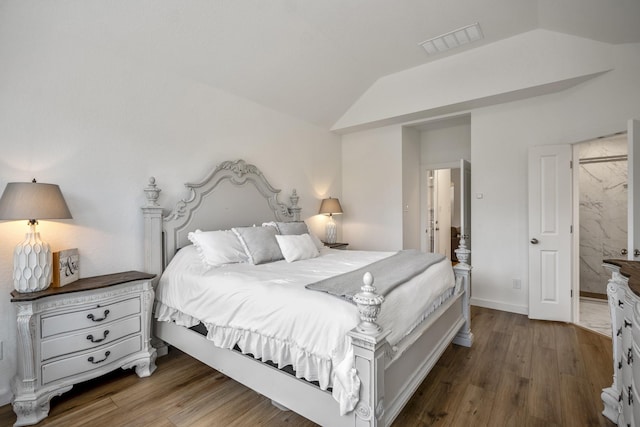 bedroom featuring lofted ceiling, baseboards, visible vents, and wood finished floors