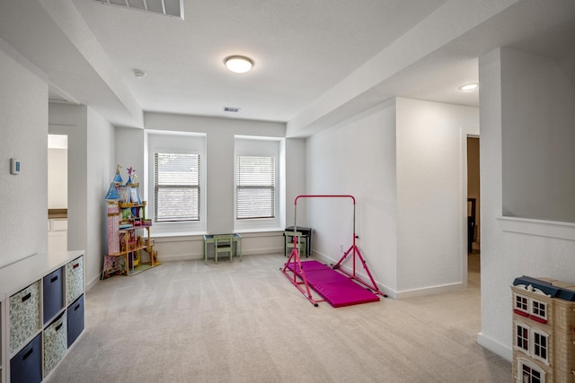 game room with carpet floors, visible vents, and baseboards