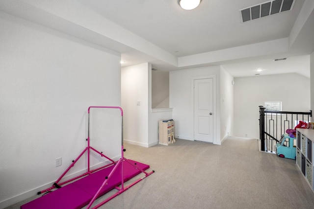 rec room with carpet, visible vents, and baseboards