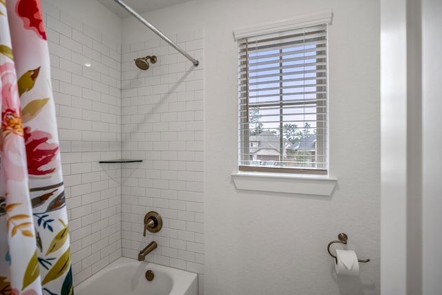 bathroom with shower / tub combo with curtain