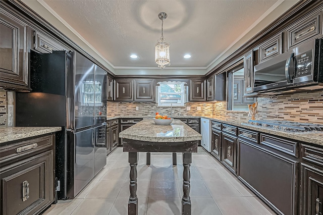 kitchen featuring pendant lighting, light tile patterned floors, tasteful backsplash, dark brown cabinets, and black appliances