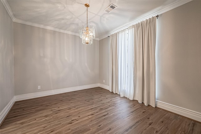 unfurnished room featuring a chandelier, visible vents, crown molding, and wood finished floors