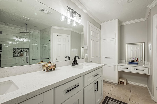 full bathroom featuring double vanity, ornamental molding, a shower stall, and a sink