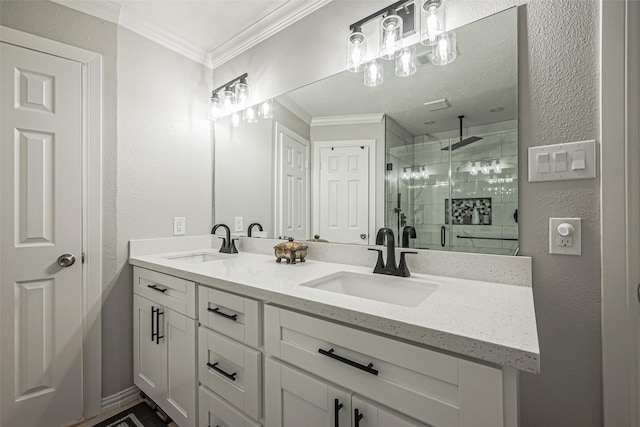 full bathroom featuring crown molding, double vanity, a shower stall, and a sink