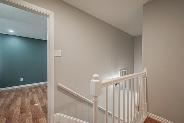 interior space featuring baseboards and wood finished floors