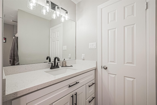 bathroom featuring visible vents and vanity