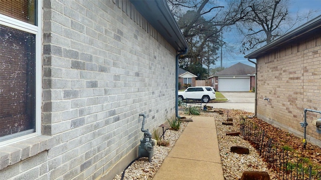 view of property exterior featuring brick siding